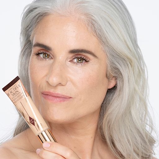 Beautiful Skin Foundation in 4 Neutral on light-tone model Light-tone model with glowy, flawless skin, wearing skin-like foundation that adds a youthful glow and looks natural along with nude pink lipstick and subtle everyday eye makeup.
