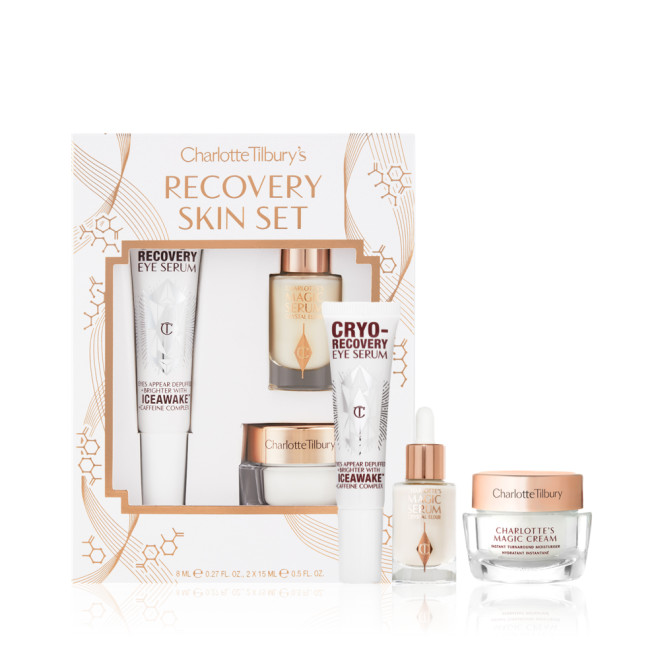Eye Serum in a white-coloured tube, luminous face serum in a glass bottle with a white and gold dropper lid, and pearly-white face cream in a glass jar with a gold-coloured lid. 