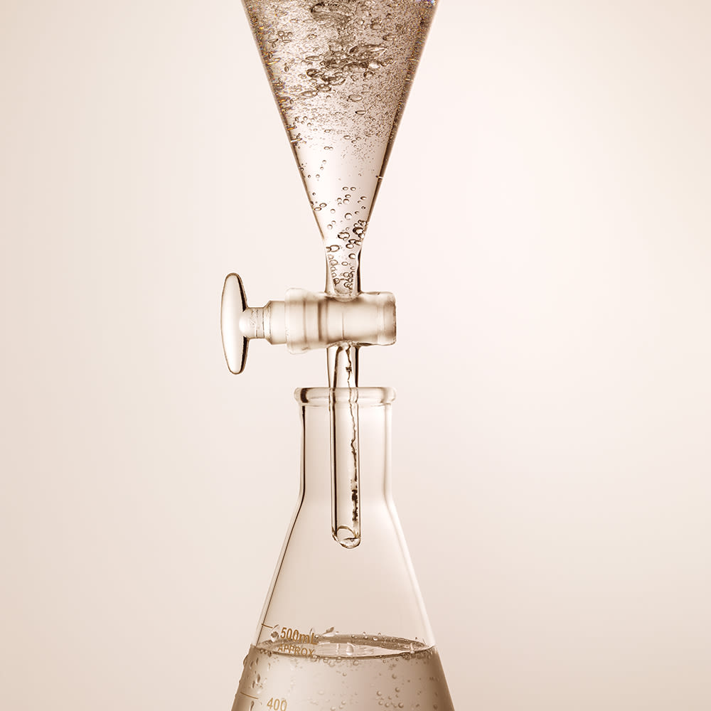 Hyaluronic Acid being tested Two laboratory apparatus with a clear hyaluronic acid inside them for testing purpose, which will be used for different skincare products.