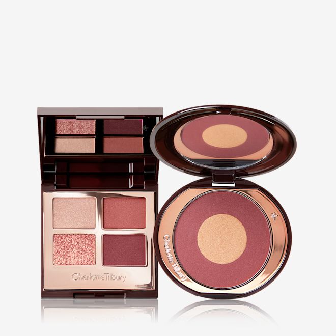Walk Of No Shame Eye Blush Kit open An open, quad eyeshadow palette with shades of cranberry and gold with a matching two-tone blush compact with a mirrored-lid.