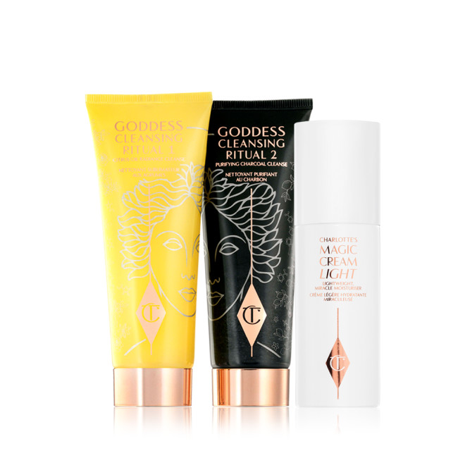 Two facial cleansers, one in lemon-yellow packaging and the other in charcoal-black, with rose-gold coloured lids along with a light face cream in white-coloured packaging.