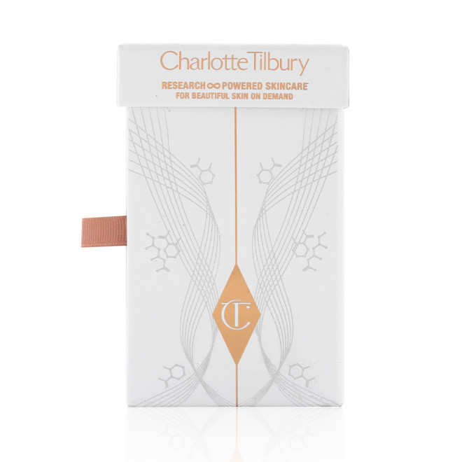 A white-coloured box containing a pearly-white face cream and its refill with the CT logo on the front, which is perfect for gifting for any occasion. 