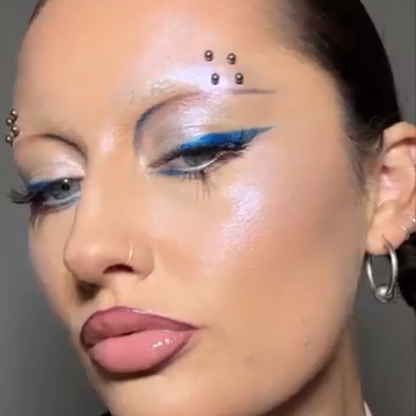 Frankie Darling wearing a futuristic makeup look using Charlotte Tilbury Beauty