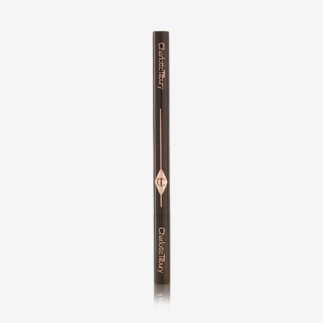 Brow Lift in Natural Black closed A closed, double-ended eyebrow pencil and spoolie brush duo with black-coloured packaging.