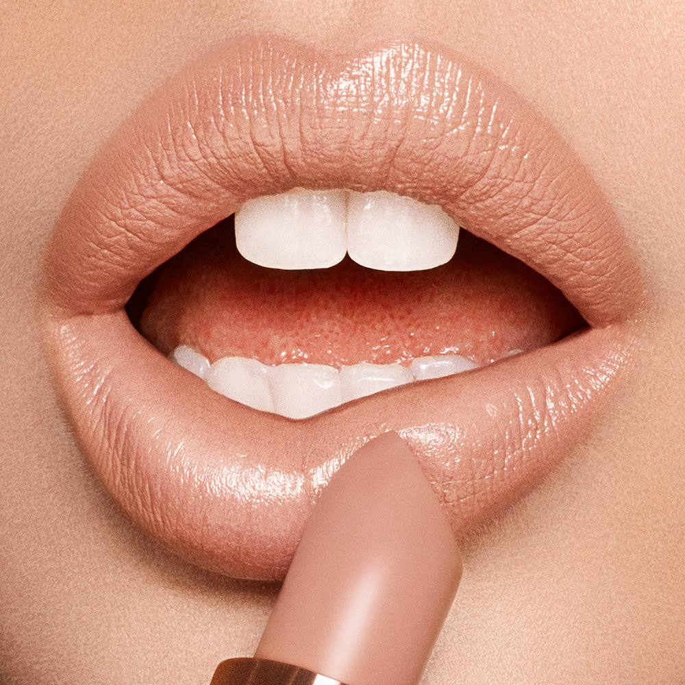 Nude Kate lip close up Model with blonde hair wearing Nude Kate Kissing lipstick