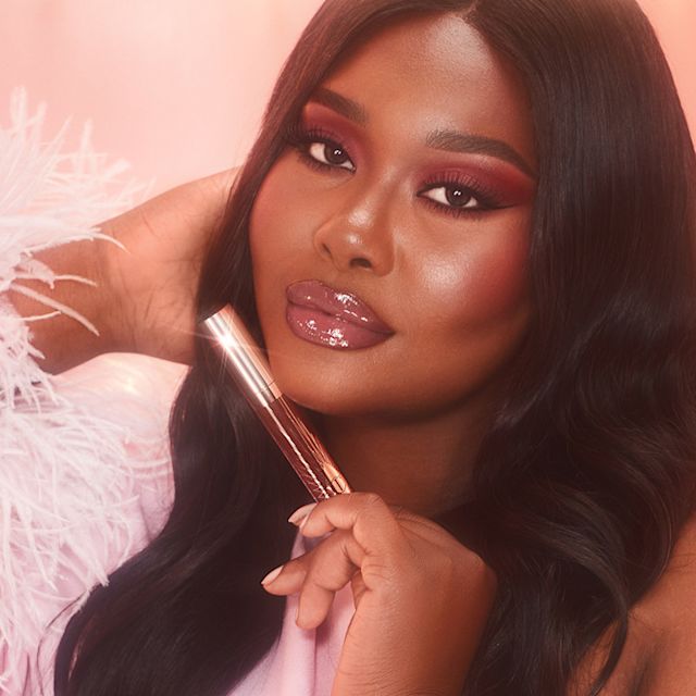 Belinda lip gloss Belinda wearing Collagen Lip Bath in Pillow Talk Deep to make lips look bigger