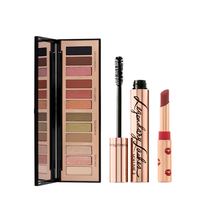 Smokey Eyes Lucky Lips Kit open An open, 12-pan eyeshadow palette in matte and shimmery shades beige, pink, silver, green, brown, pink, orange, red, black, black mascara in gold-coloured tube, and maroon lipstick in gold-coloured tube.