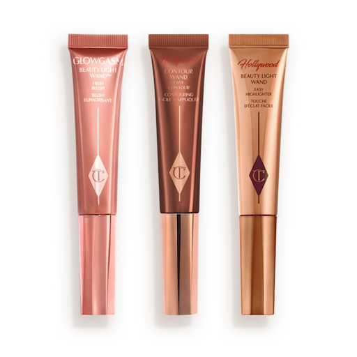 Beauty Light Wands closed Medium-pink liquid blush wand, glowy brown contour wand, and soft candlelight-gold-coloured liquid highlighter wand.