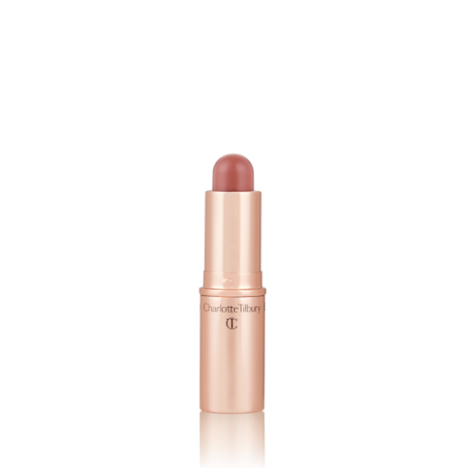 Quick & Easy Instant 5 Minute Date Night Look lip and cheek stick open An open, lip and cheek colour stick in a glowy soft pink shade in a golden-coloured tube.