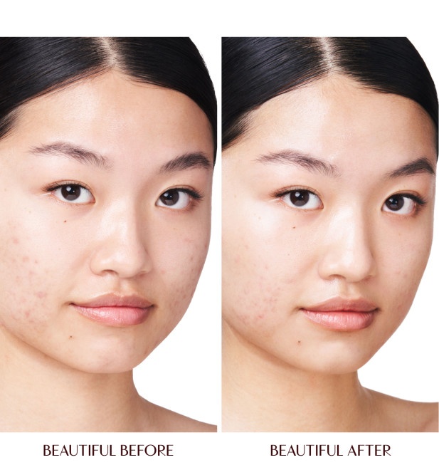 Bare-faced deep skin model wearing Disney100 x Charlotte Tilbury Magic Cream.