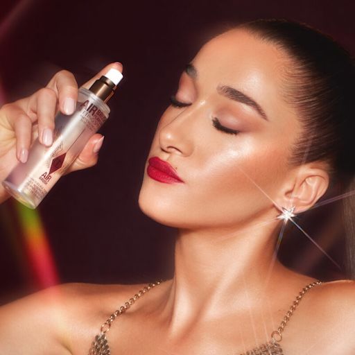 Bella Tilbury holding Airbrush Flawless Setting Spray Bella Tilbury holding Airbrush Flawless Setting Spray