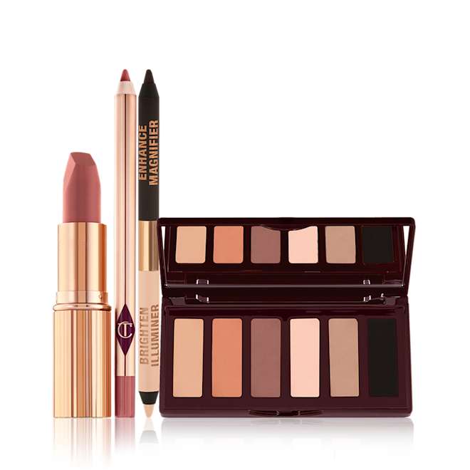 Supernudes Makeup Look open An open matte lipstick in a gold-coloured tube, lip liner pencil, double-ended eyeliner pencil in black and nude beige shades, and an open, mirrored-lid six-pan eyeshadow palette with matte eyeshadows in brown, peach, and beige shades.