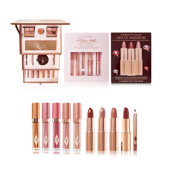 Charlotte's Complete Magic Holiday Collection displayed A makeup kit with quad eyeshadow palettes, cream eyeshadows, and 12-pan eyeshadow palette, highlighter compacts, lip pencils, mascara, eyeliner, lipstick, and lip glosses, pack of nude pink lipstick and lip glosses, lipstick trio gift boxes, shimmery lip glosses in five shades, matte and satin-finish lipsticks in nude shades, and lip liner pencil in pink.