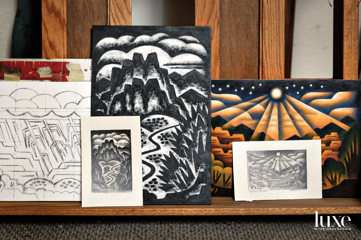 Paintings propped on a shelf in Sushe Felix's studio.