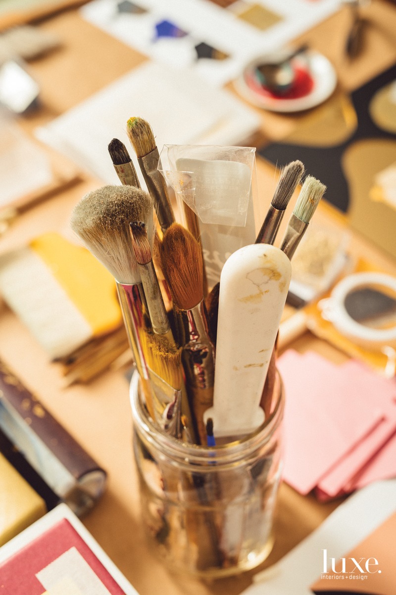 Hunt's work table holds her tools, including brushes and gold leaf. Hunt's work table holds her tools, including brushes and gold leaf.