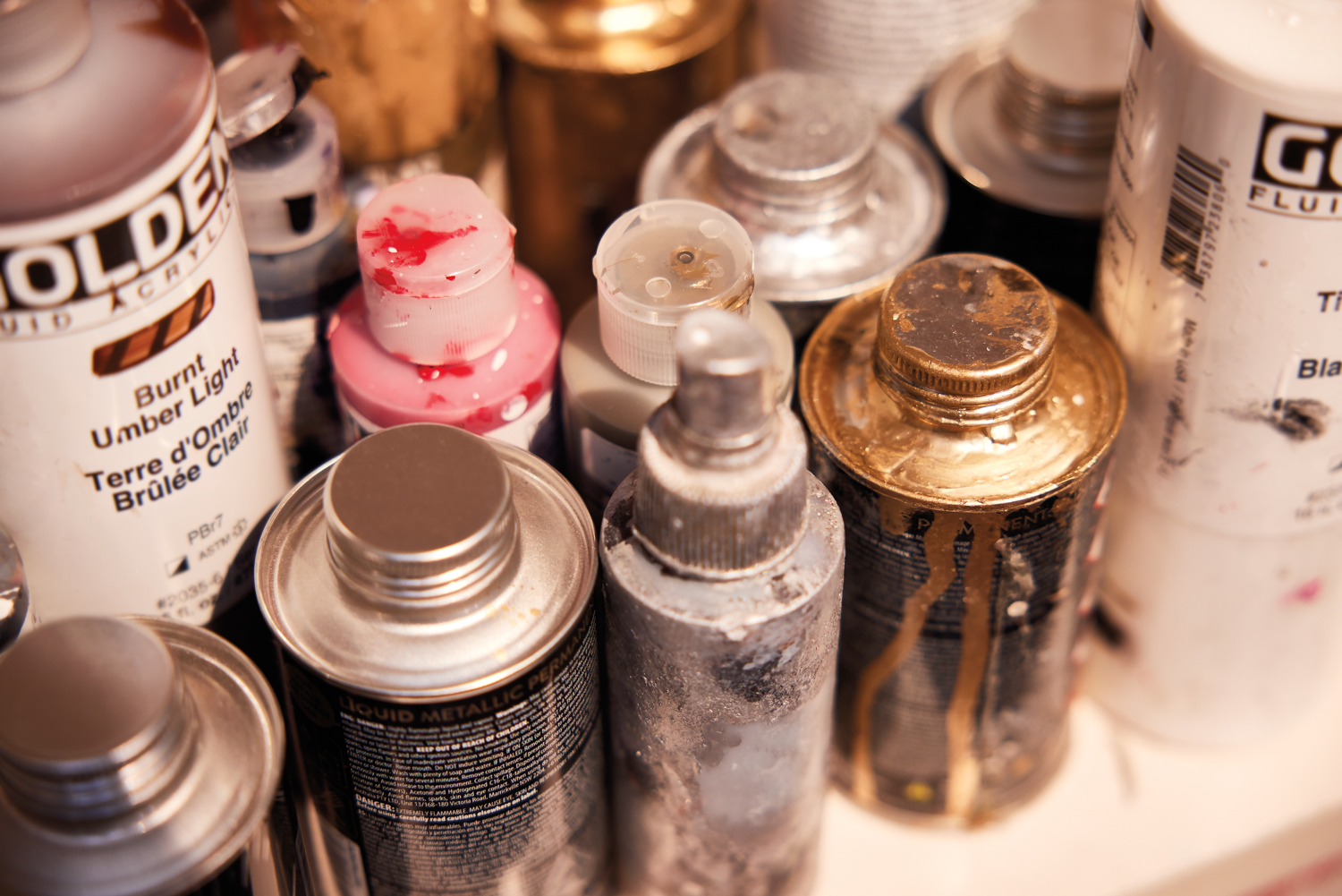 a vignette of bottles of paint