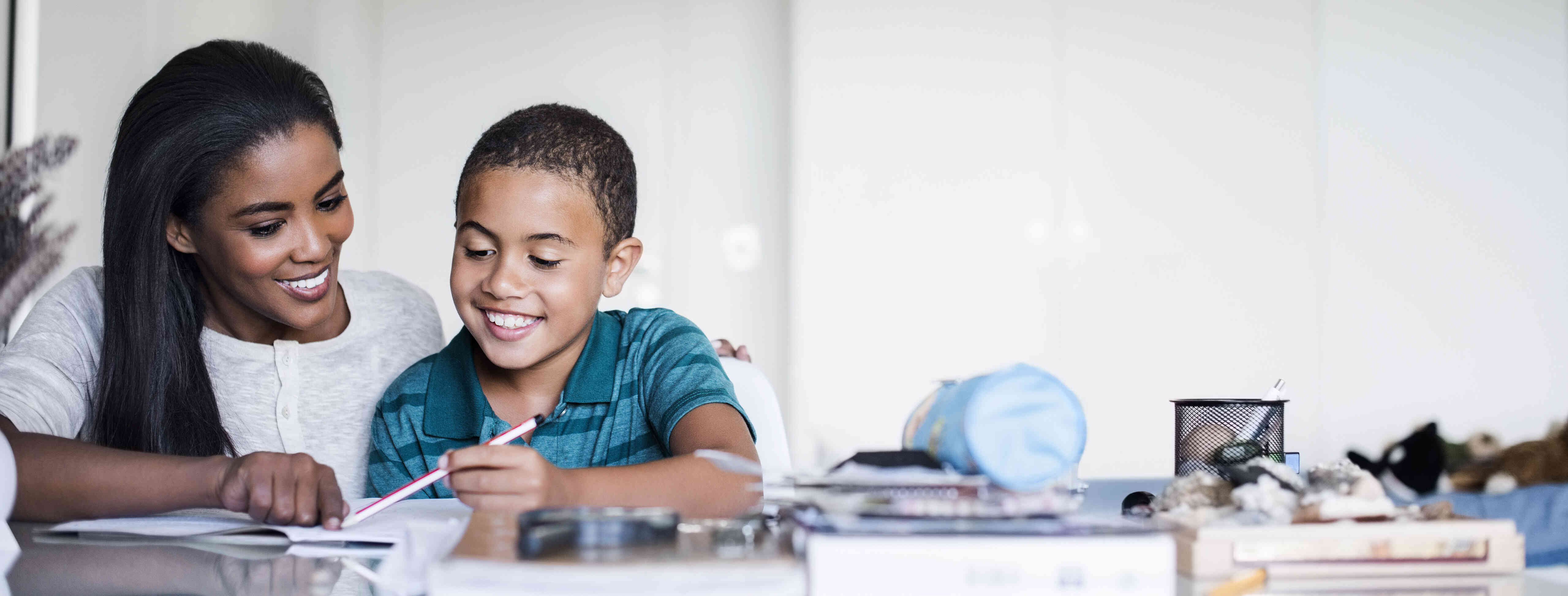 nanny helping child with homeschool work