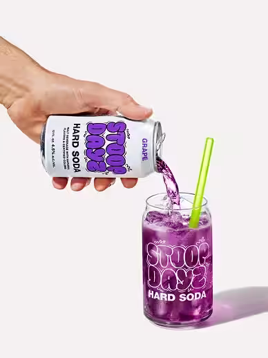 Grape Stoop Dayz Hard Soda being poured into a glass