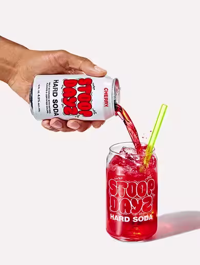Cherry Stoop Dayz Hard Soda being poured into a glass