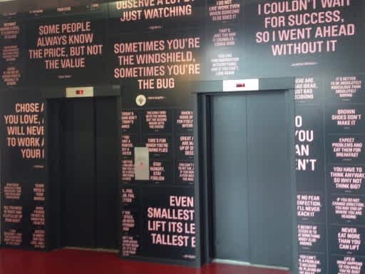 View of elevator doors with sayings