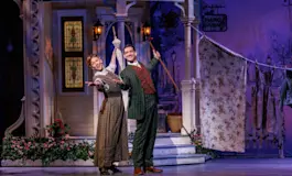 Music Man company in roles of Mrs. Paroo and Harold Hill. Photo by Marshall Meadows.