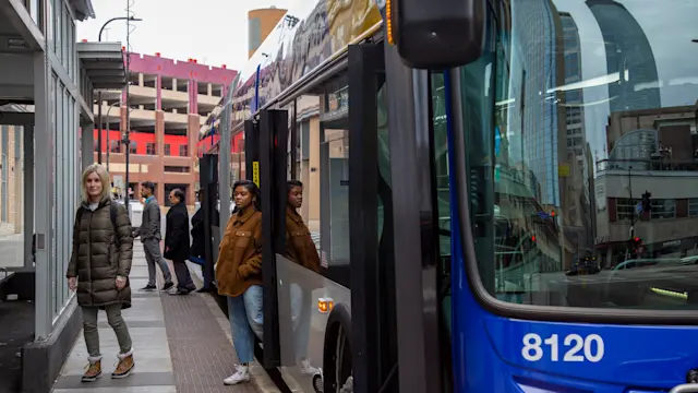 Passengers at bus stop. Photo courtesy of Metro Transit.