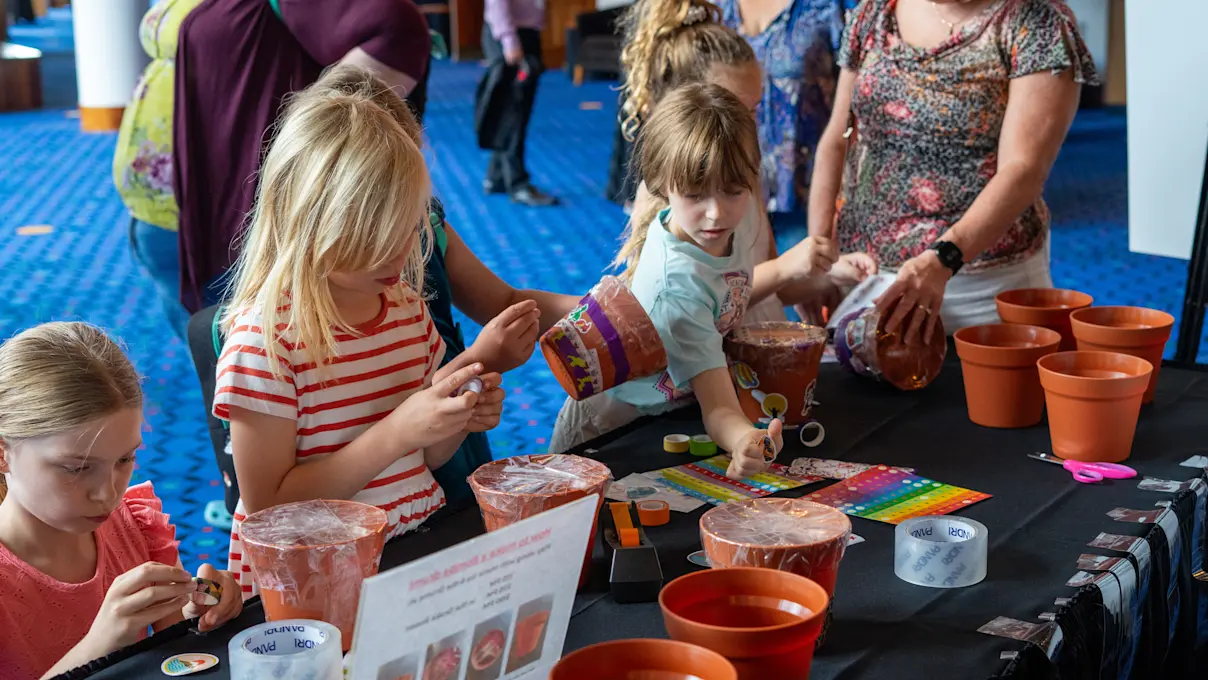 Children participating in crafts at the 40th Anniversary Open House. Photo by Imani Mansfield.