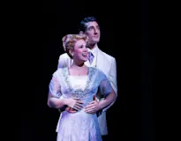 The Music Man company in roles of Marian Paroo and Harold Hill. Photo by Marshall Meadows.