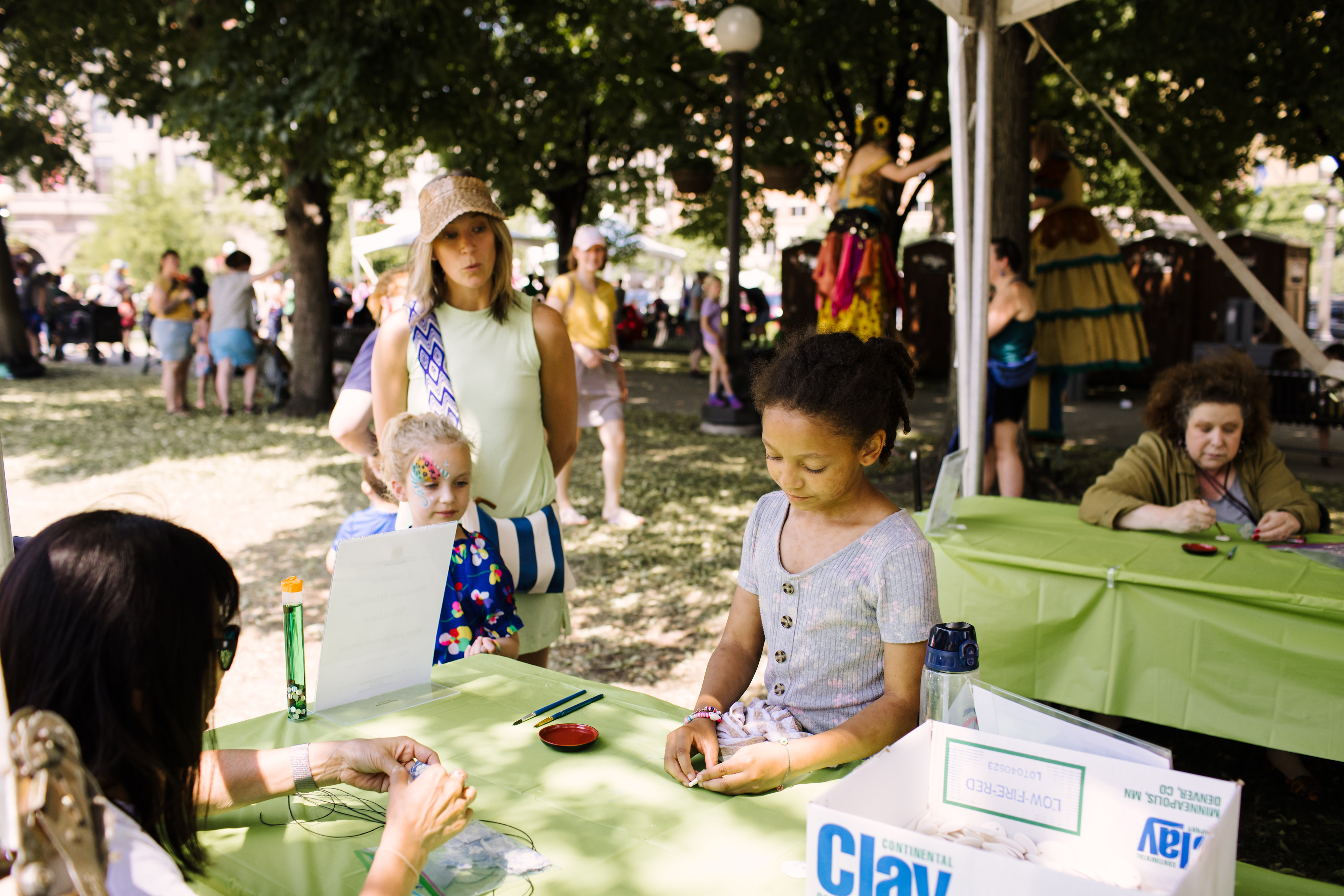 Child participating in crafts at the Flint Hills Family Festival 2023. Photo by Laura Alpizar.