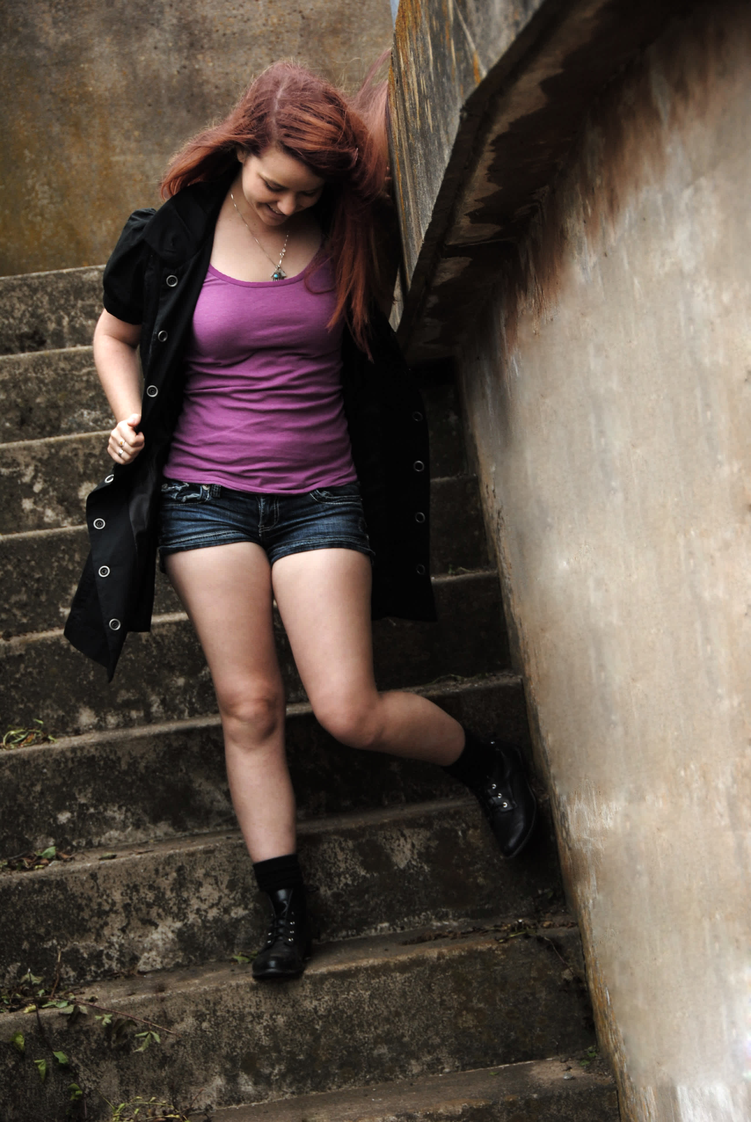 Girl walking down a stairwell.