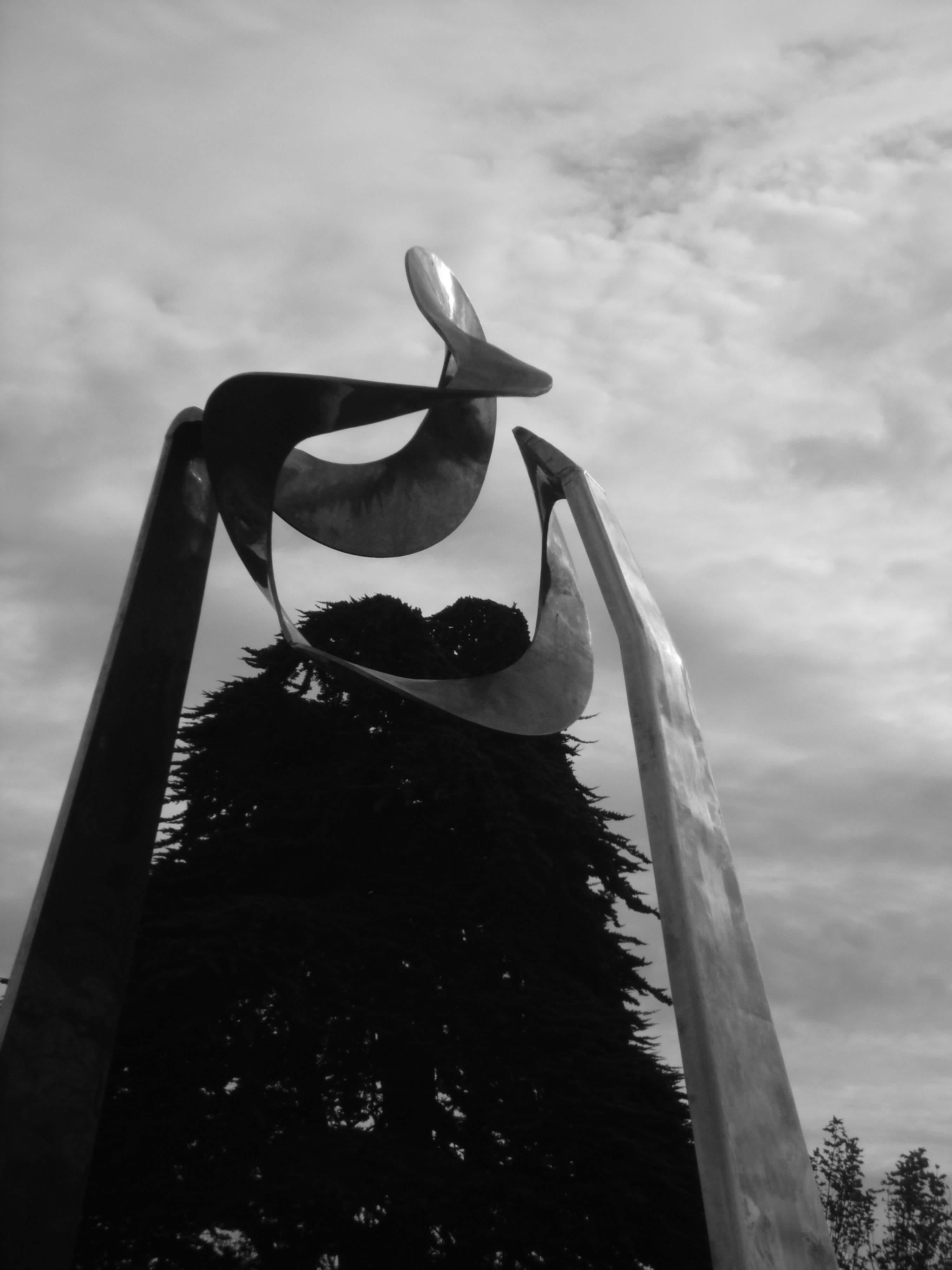 Statue reflecting the clouds in black and white in Embarcadero, San Francisco, California. 