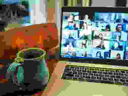 Computer screen with photos of people on a video call