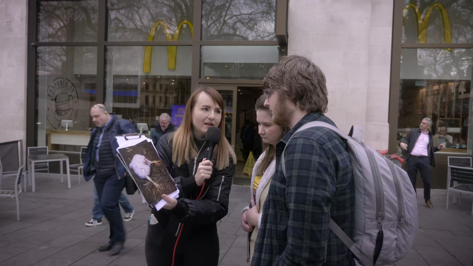 Volunteer interviewing the public about mcdonalds