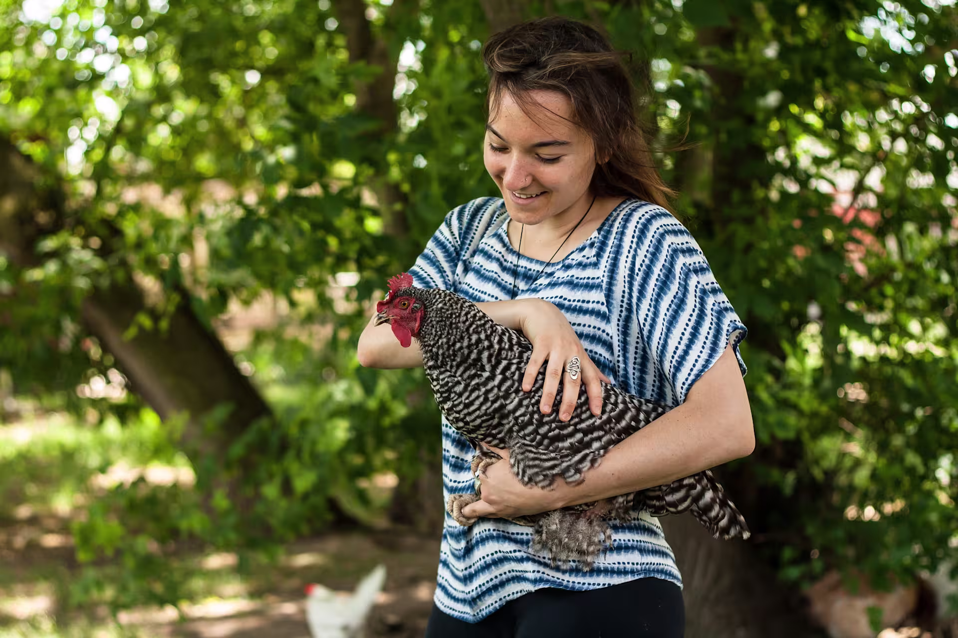 woman-holding-chicken-outside