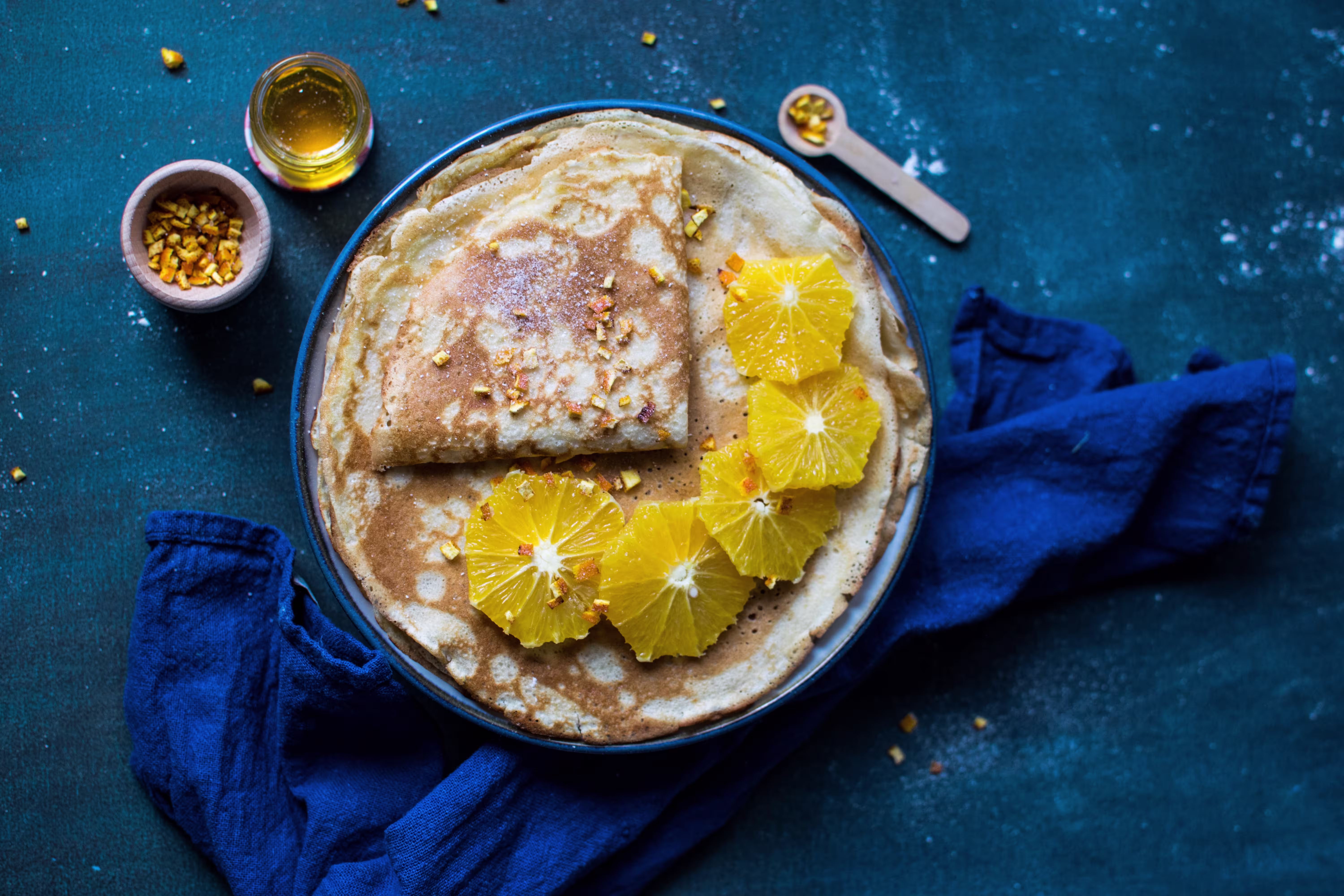 Stack of pancakes with orange