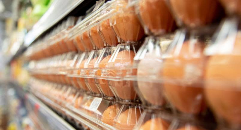 Closeup of eggs in clear cartons on a shelf