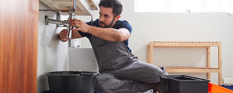 Feature image - Home repair contractors A man operating a power sander in a workshop
