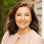 User story image - Enforcing support Middle aged woman with brown hair, smiling