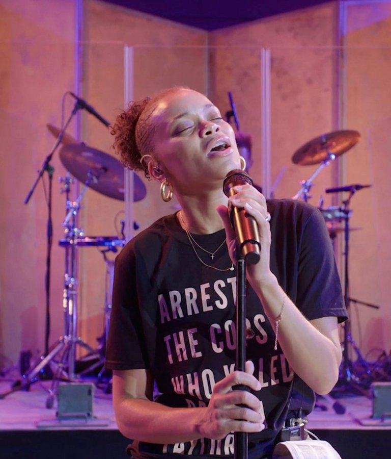Singer Andra Day performing with her band on the stage of the Hollywood Bowl
