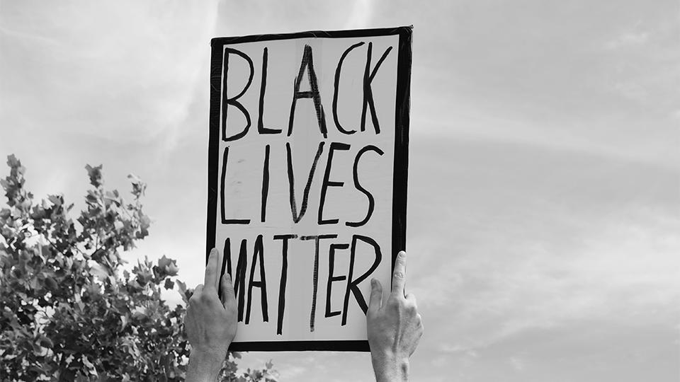 Protestor's hand-written sign that reads Black Lives Matter.