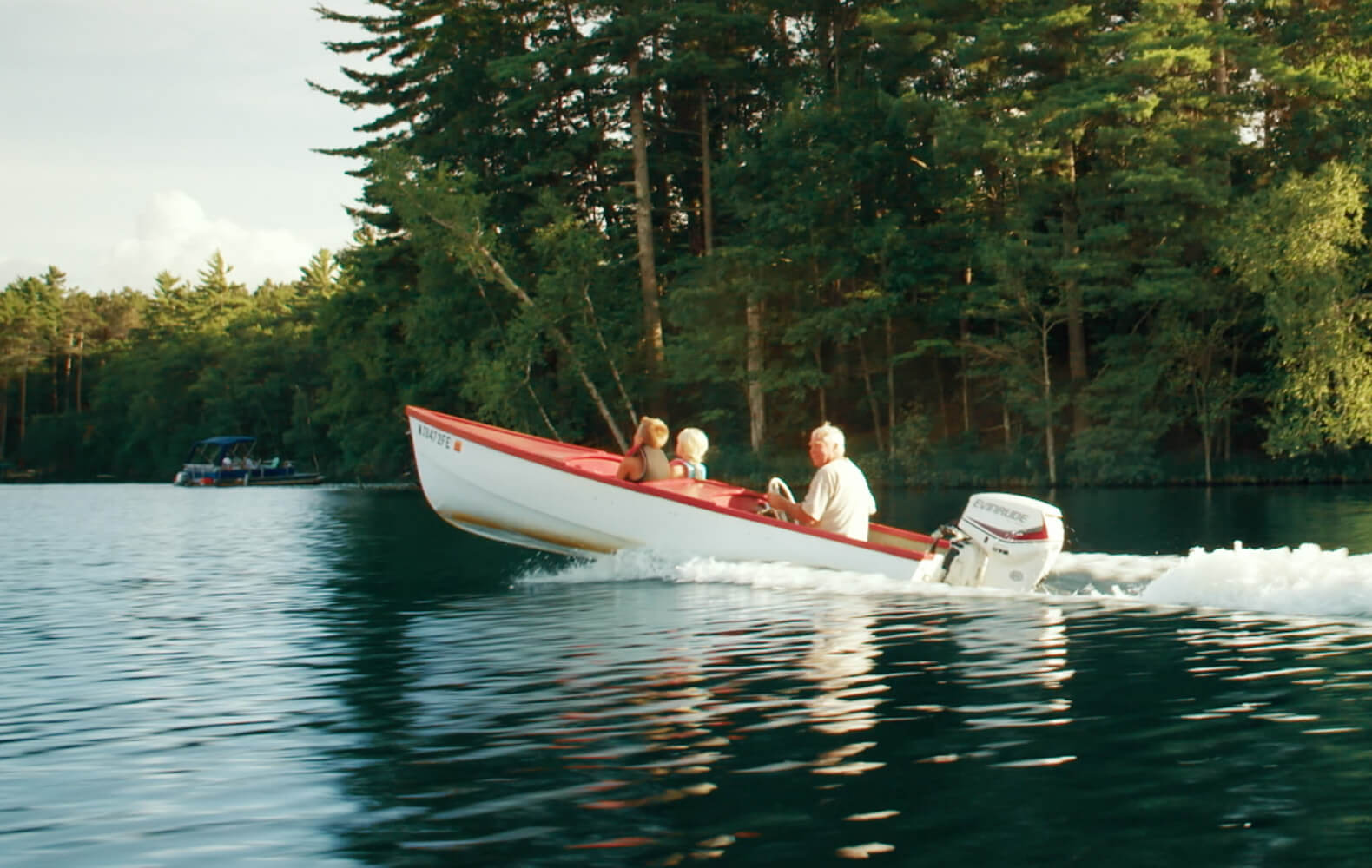 family on boat in lake