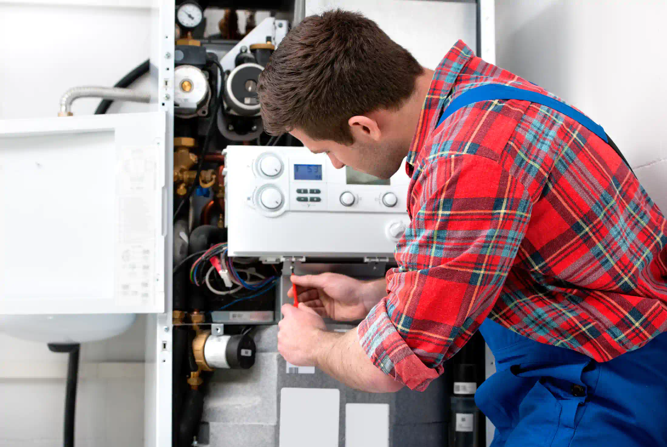 Technician servicing a heating system