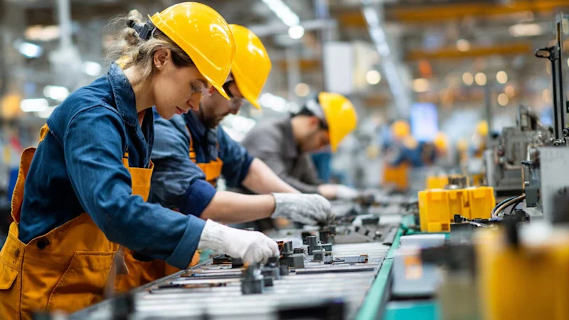 Factory workers on manufacturing line