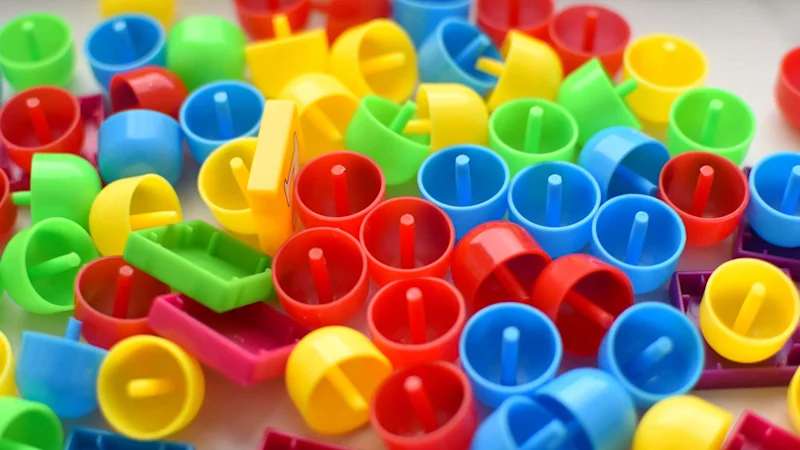 Various plastic toy pieces in primary colours