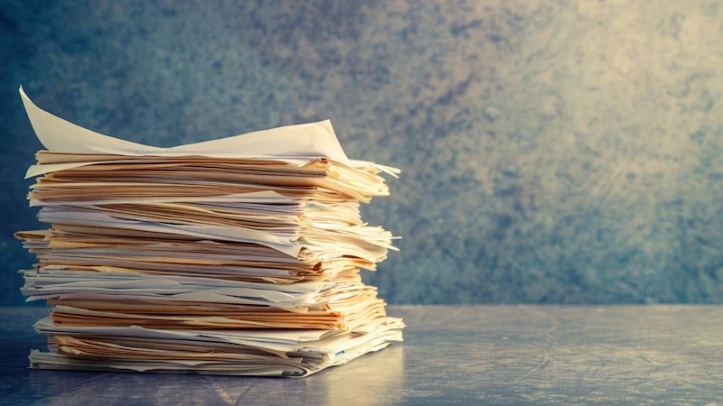 Paperwork on an empty desk