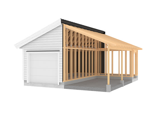 Halvferdig hus med hvit garasje, svart tak og synlig tremontering på grå betonggrunn