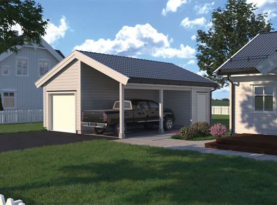Grå dobbelt carport med svart pickup under, hvit husfasade, plen og blå himmel.