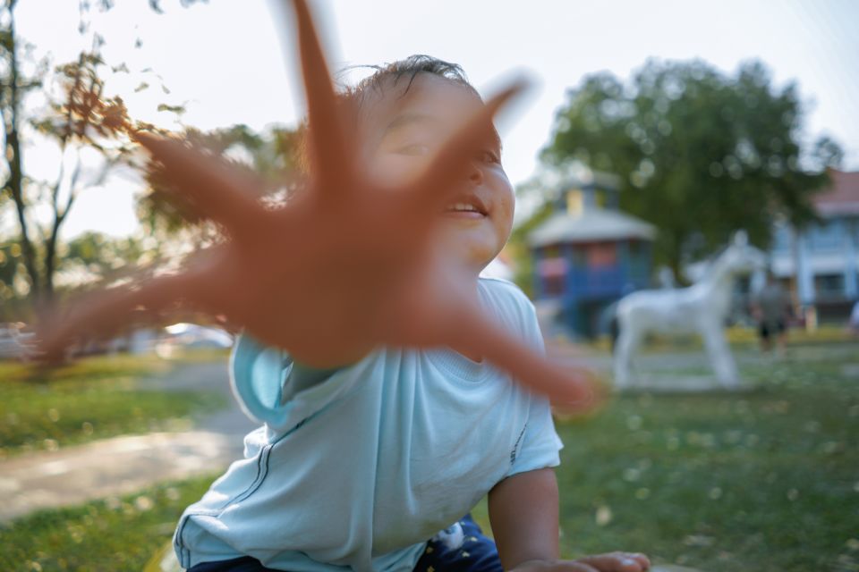 Boys hand reaching for camera