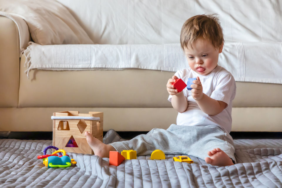 Boy with special needs playing with blocks
