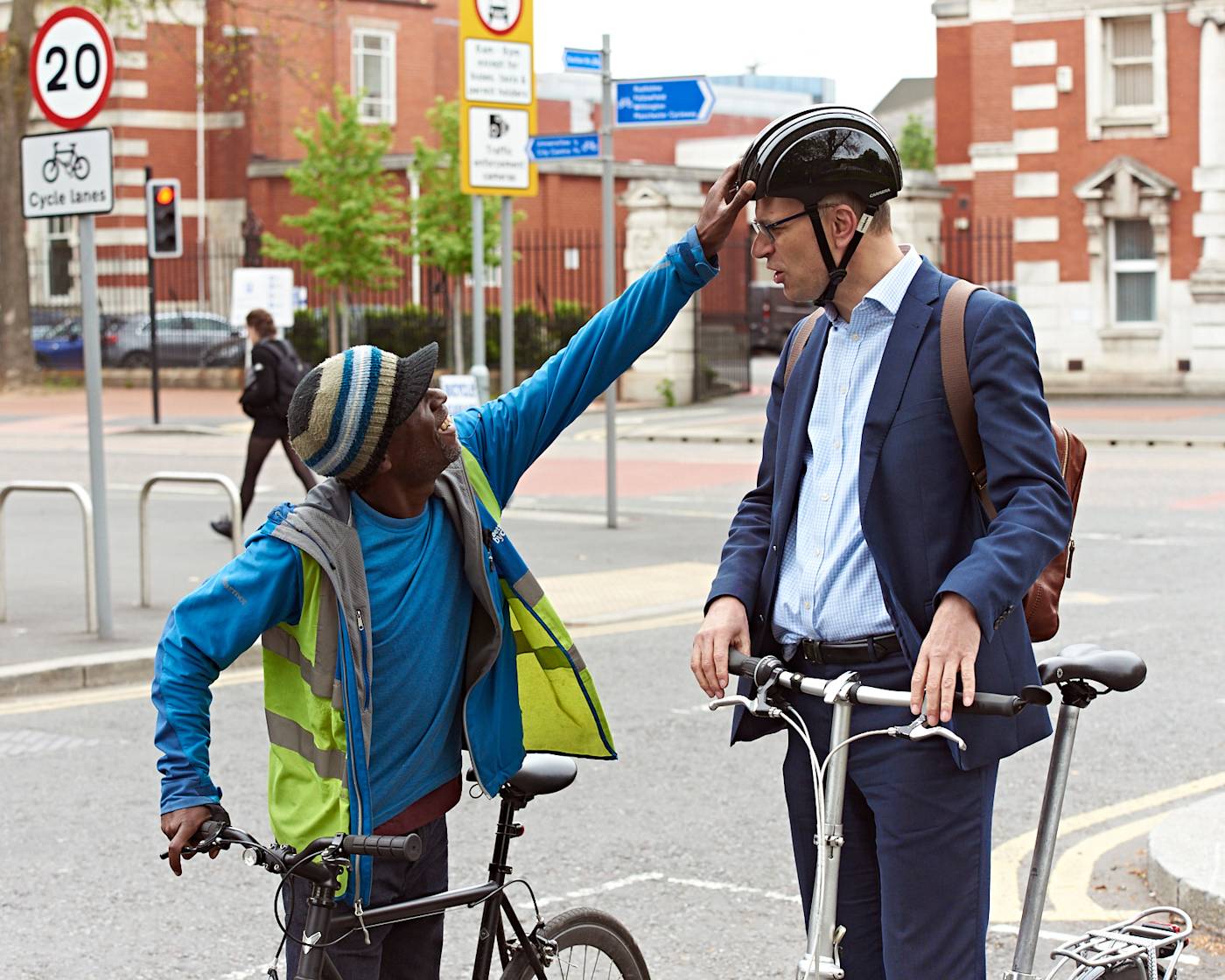 Cycle training 1-2-1 session with instructor adjusting trainees helmet